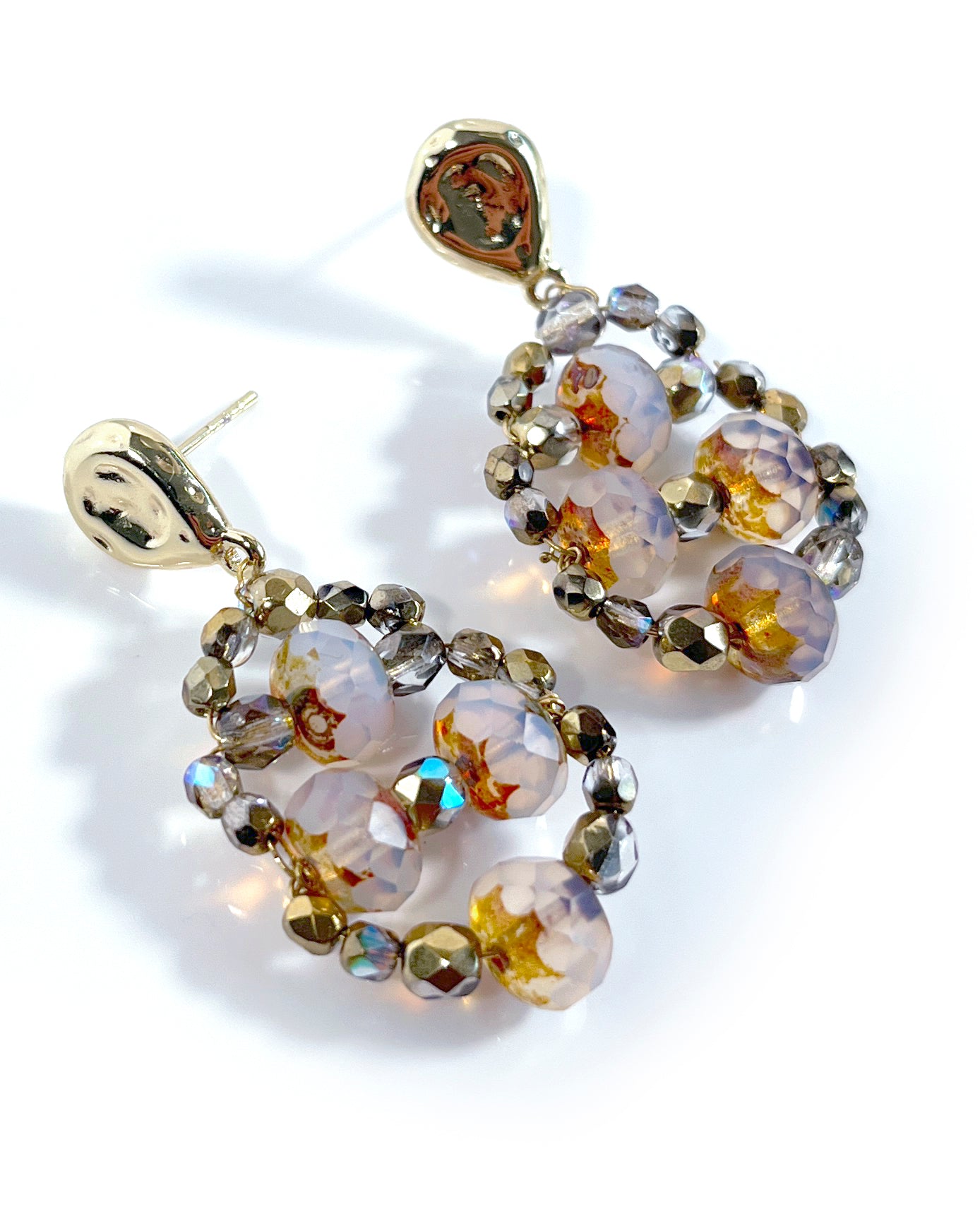 CALA earrings with white and gold crystals