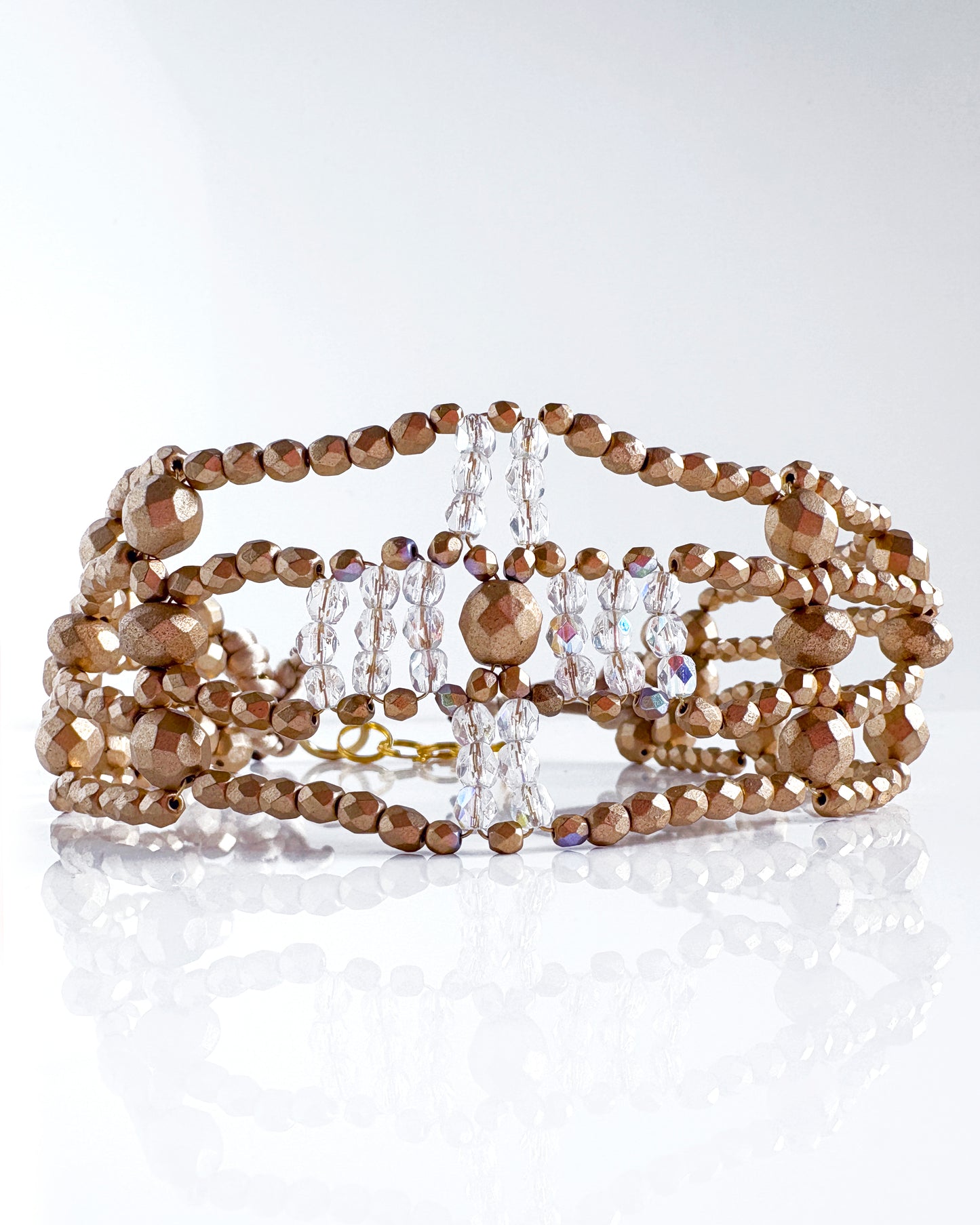 Transparent and gold cross choker