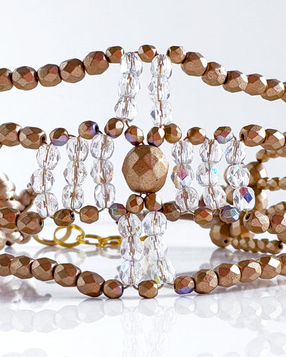 Transparent and gold cross choker