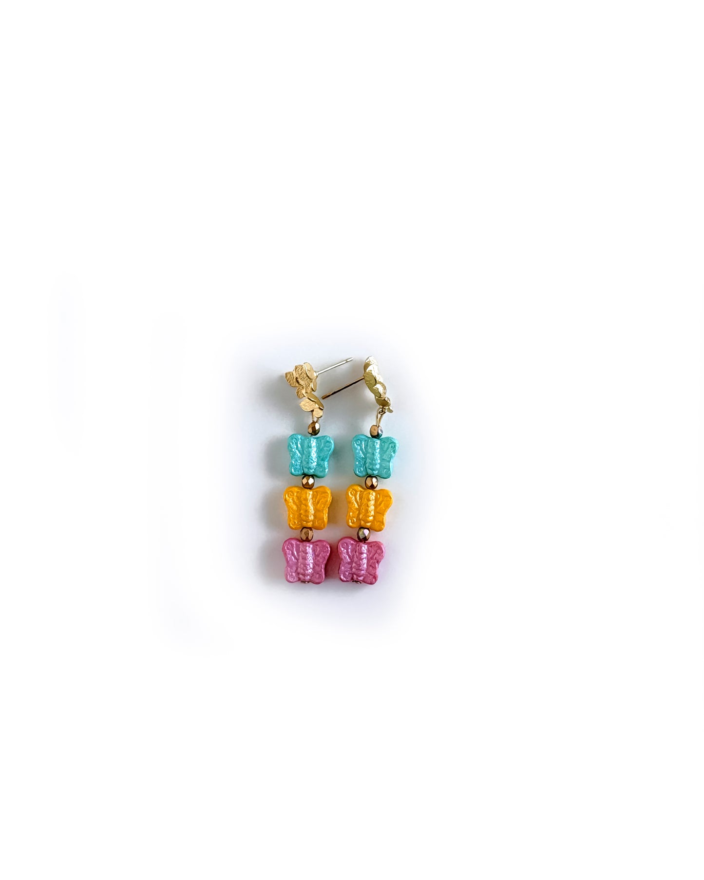 Pendientes Papillon Pastel con tres mariposas de cristal en tonos turquesa, rosa pastel y amarillo suave
