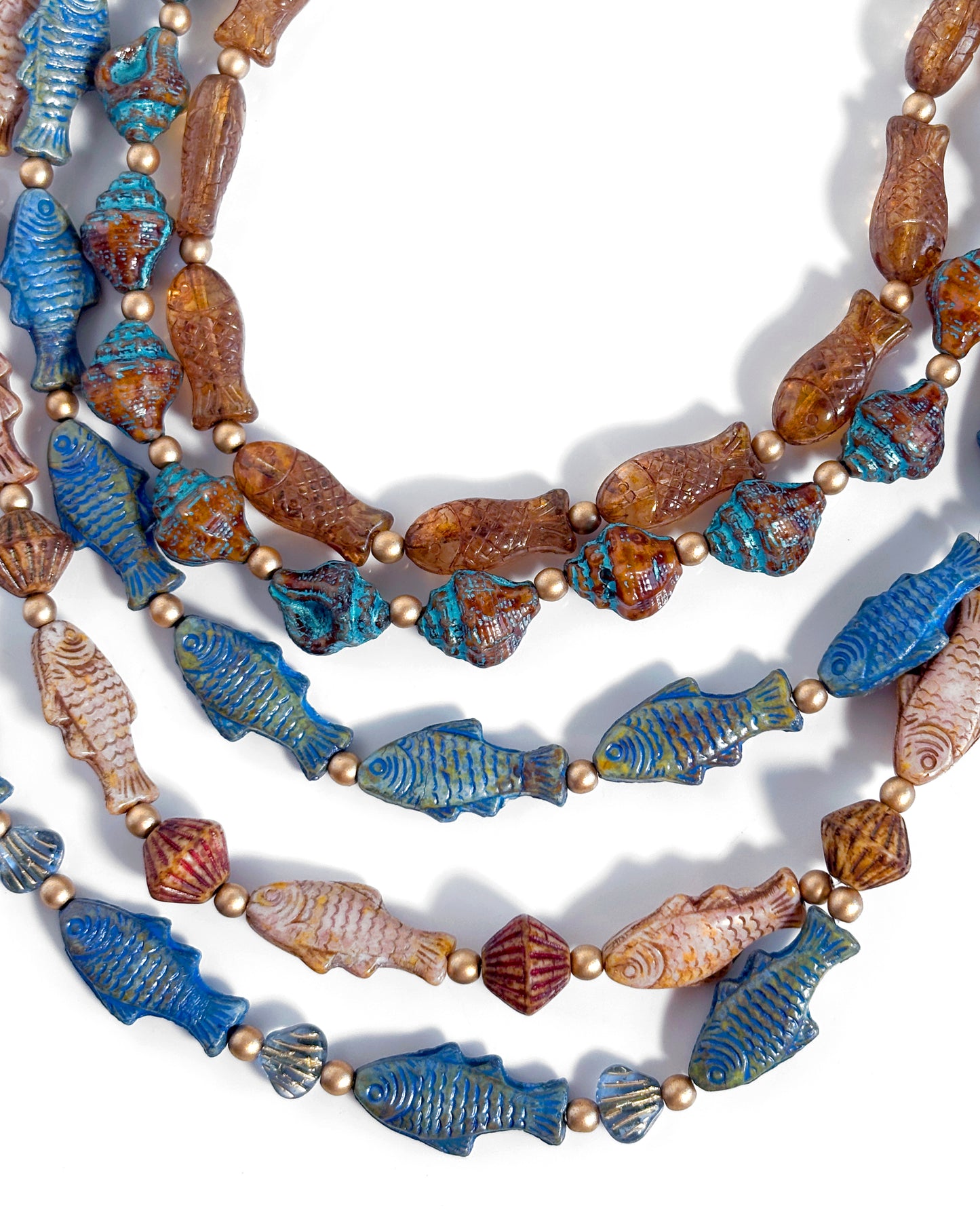 Boho Waterfall Necklace with Blue and Brown Fish and Cowrie Shells