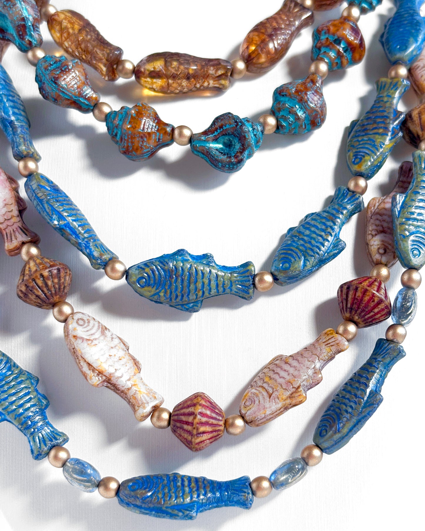 Boho Waterfall Necklace with Blue and Brown Fish and Cowrie Shells