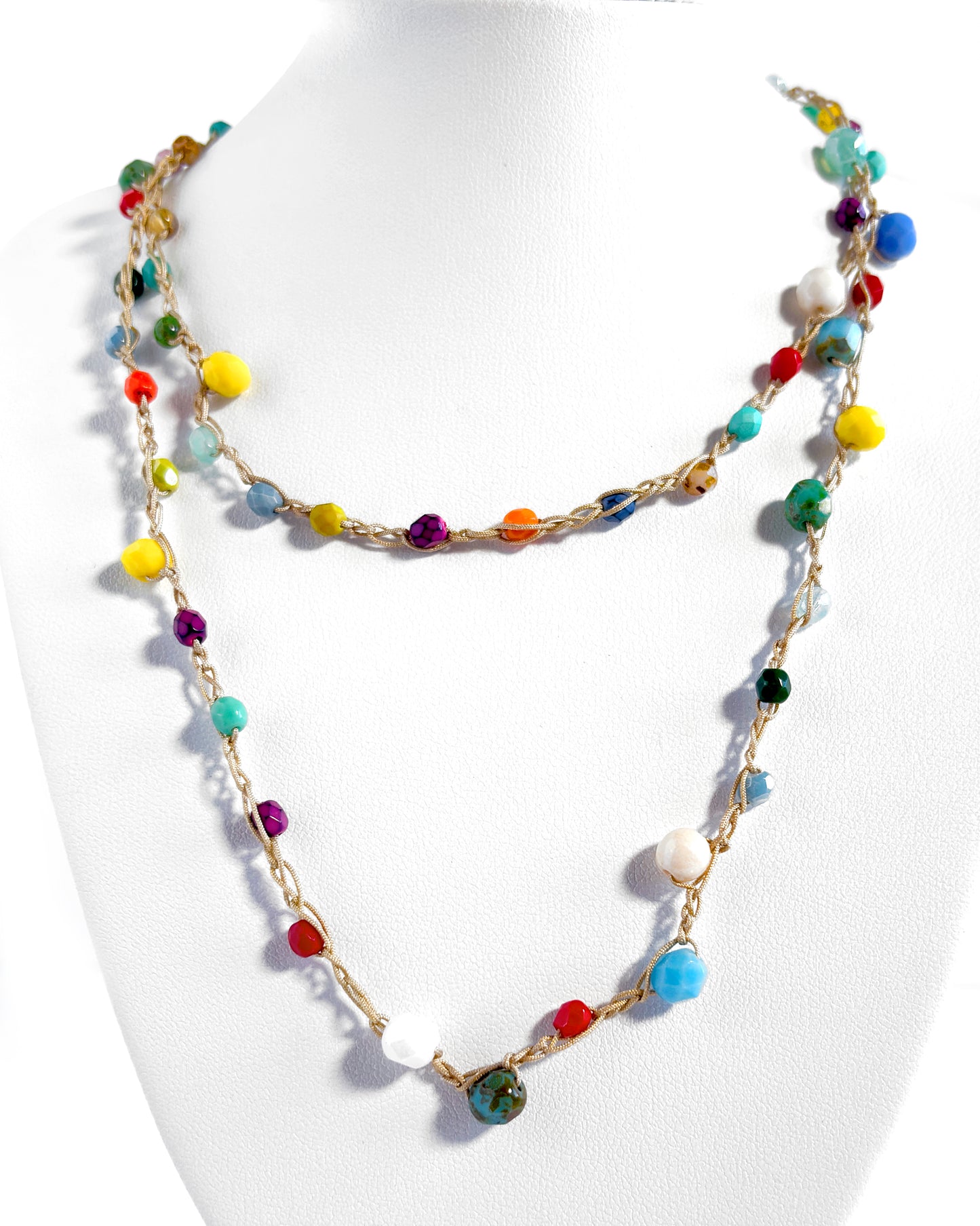 Long crochet necklace with small multicolored crystals